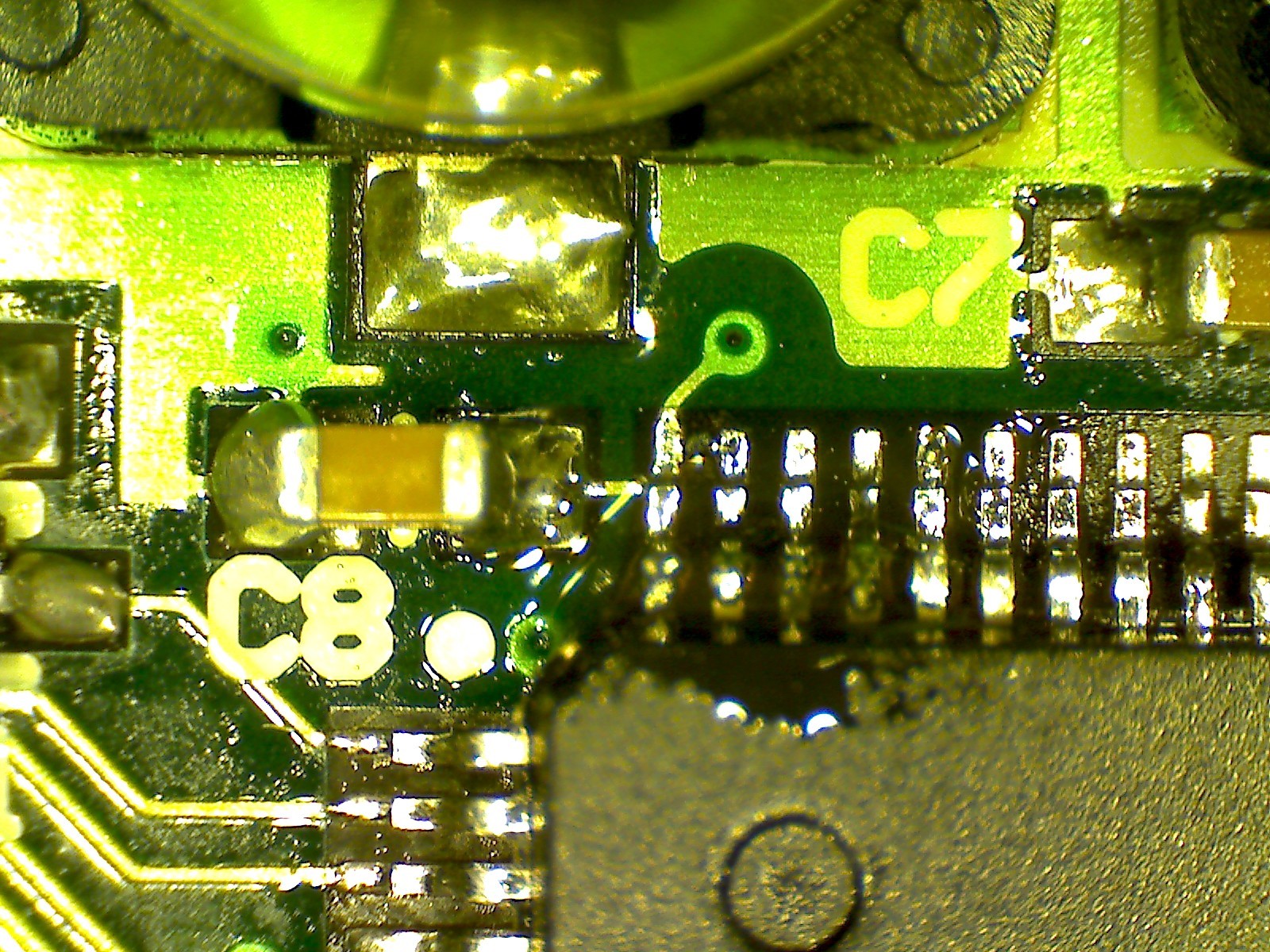 A solder fleck between two microcontroller pins, causing a short.