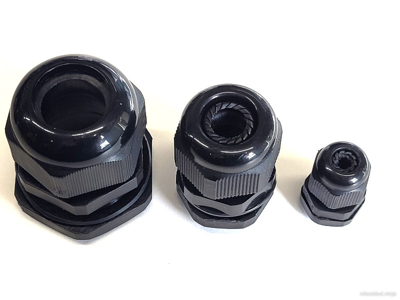 Three sizes of cable gland.