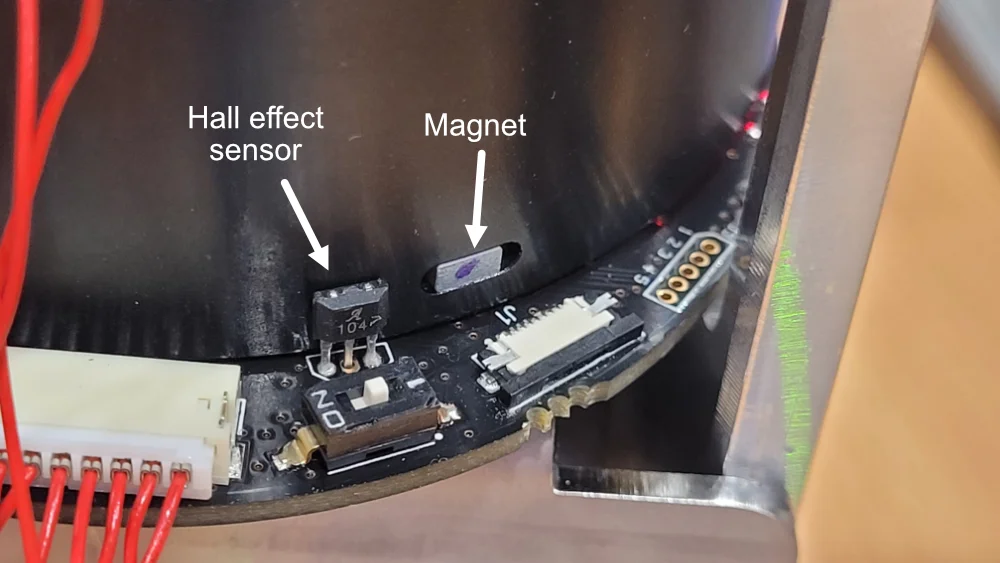 A hall effect sensor on a BLDC Miranda motor by Overview. A magnet is embedded in the rotor and the hall effect sensor detects when the magnet passes it, using it to locate the absolute rotation of rotor.