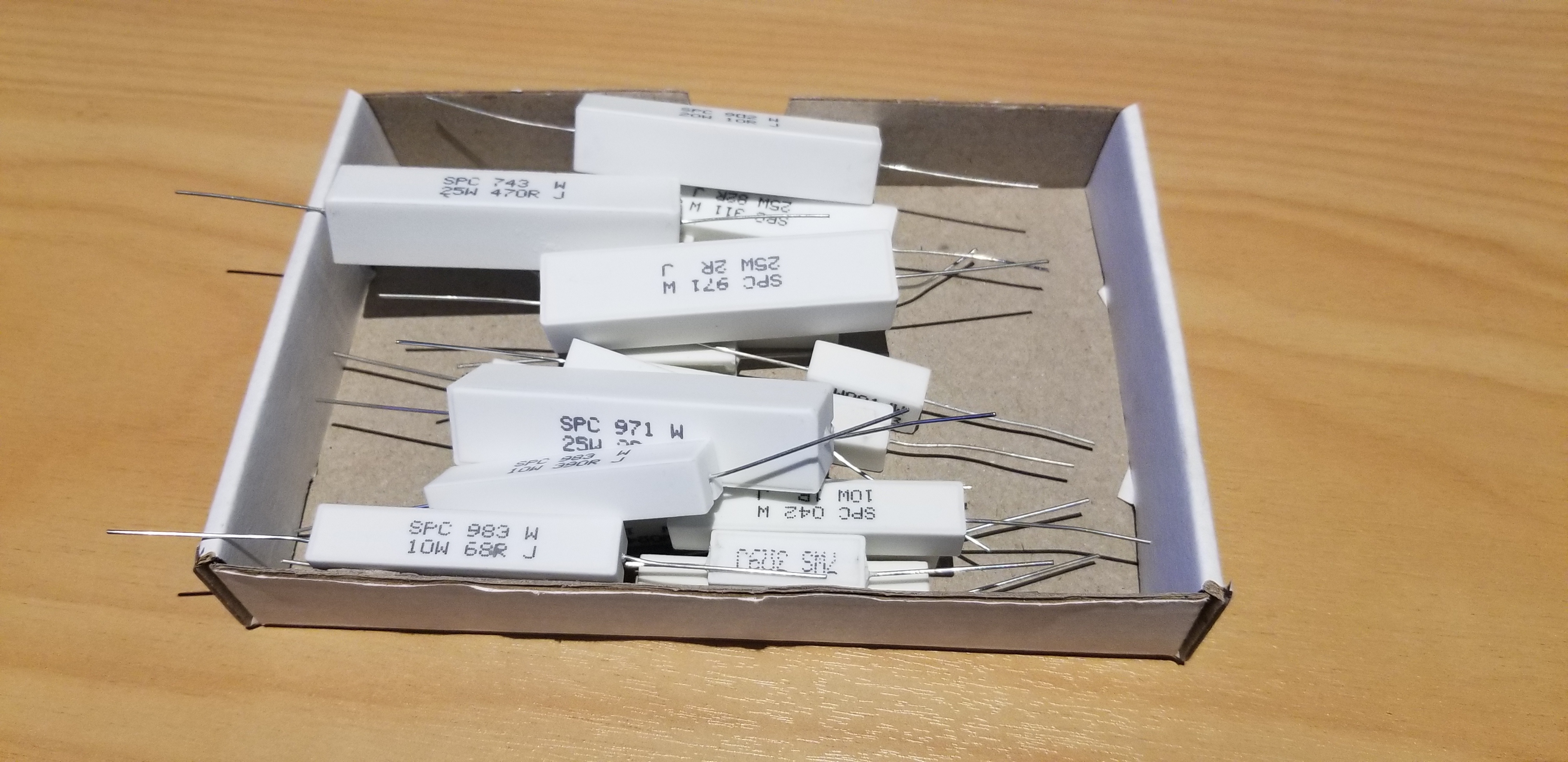A bunch of ceramic power resistors rated from 5 to 25W of power dissipation.
