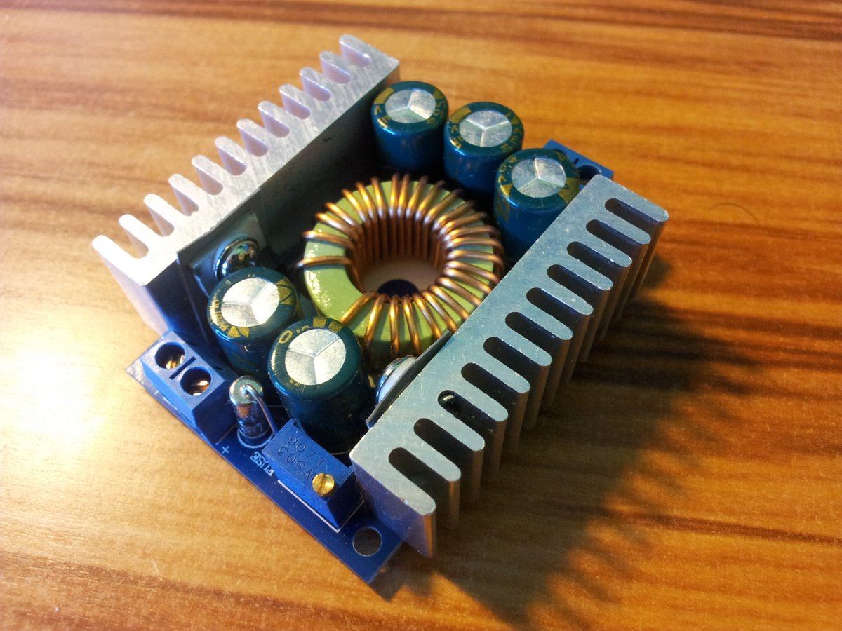A 12A, 4.5-30V in, 0.8-28V out DC-DC buck converter from AliExpress. Rated power is 100W without active cooling, 200W with active cooling.