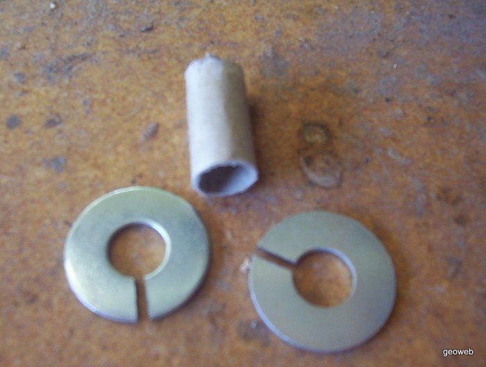 The cardboard core and two slotted side washers. The slots prevent eddy currents from forming and wasting power.