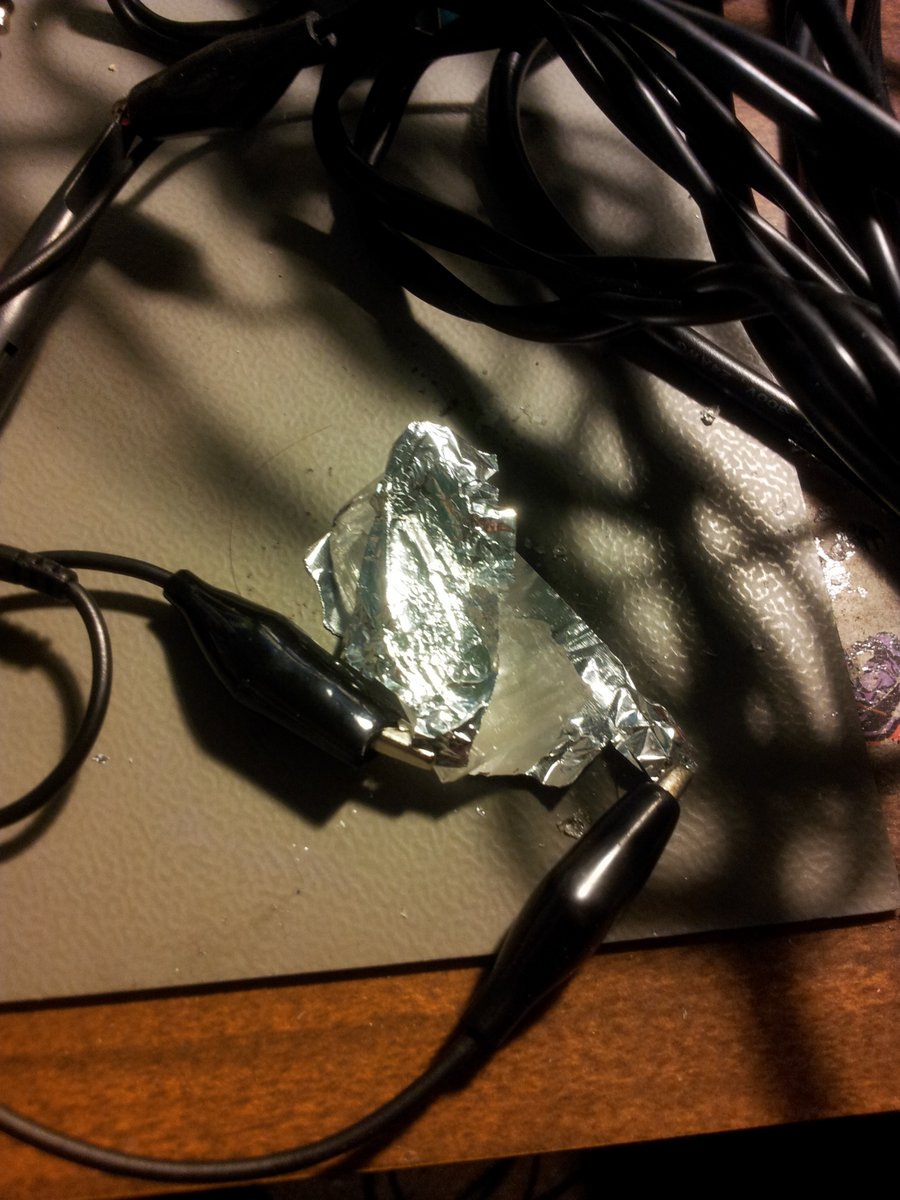 The simple setup to generate a measurable voltage from the piezo. The two tin pieces of tin foil where connected up to an oscilloscope.