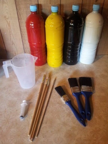 The various things needed for painting, gel-coat, paint brushes, measuring jugs, catalyst and acetone.