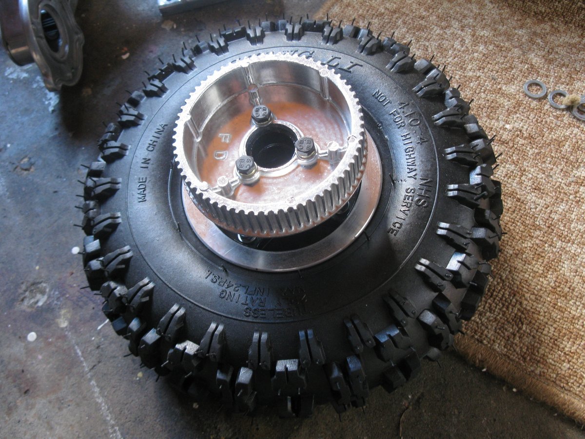The wheel cog which is driven from the motor by a belt.